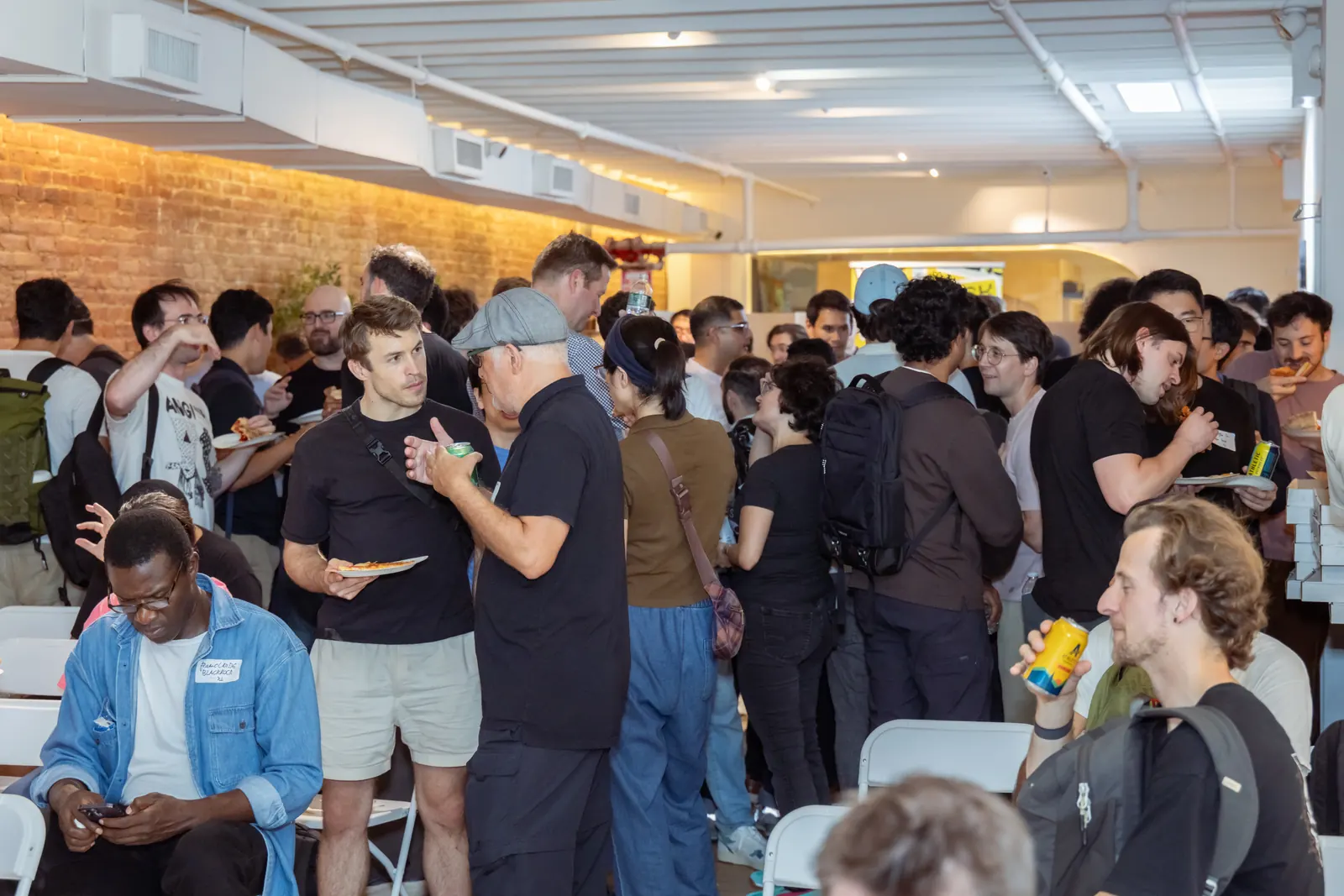 Attendees talking at the Blacksmith systems meet-up in New York